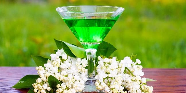 Image is showing a glass of absinthe